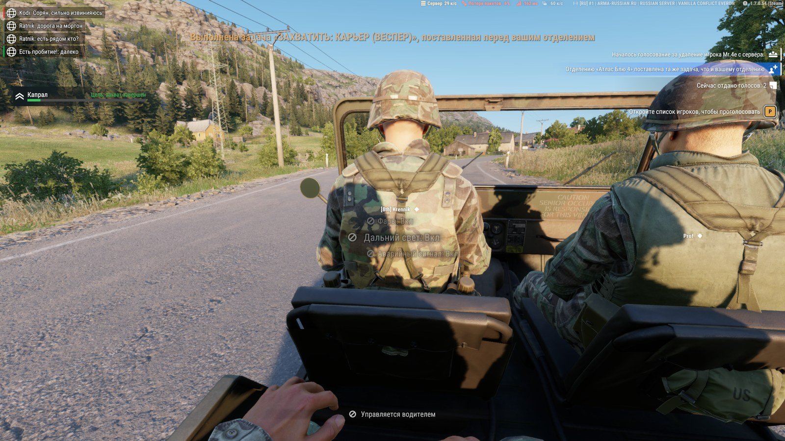 Arma Reforger in-vehicle HUD showing a mission-complete alert, a player-vote notification, rank and packet-loss readouts, and vehicle dashboard status for headlights, high beams, and hazard signal